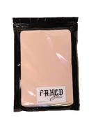 Faked Skin practice pad in its labelled black resealable package, front view